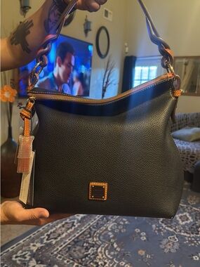 Dooney & Bourke Black Pebble leather twist strap hobo. NWT